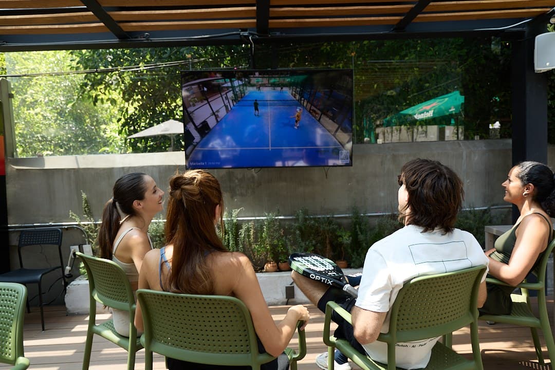 Players watching Clutch highlights on a club TV